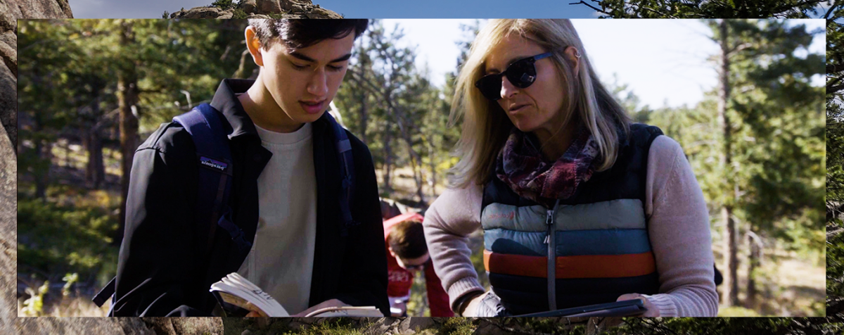 student and teacher in mountain landscape